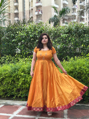 Hand embroidered mustard silk tissue anarkali with maroon brocade border