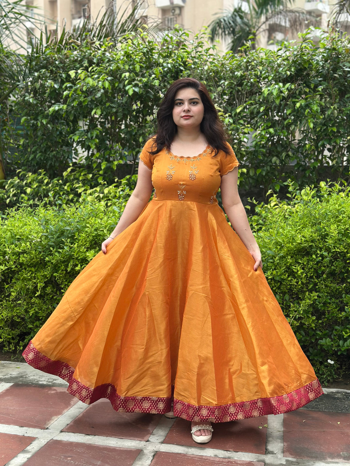 Hand embroidered mustard silk tissue anarkali with maroon brocade border