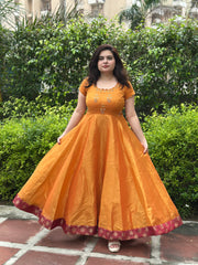 Hand embroidered mustard silk tissue anarkali with maroon brocade border